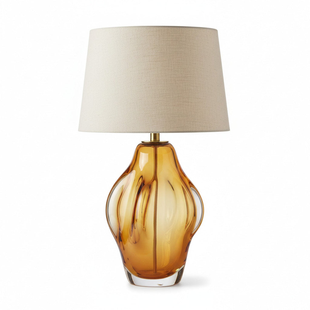 Murano-style hand-blown amber glass table lamp with natural linen shade and brass hardware