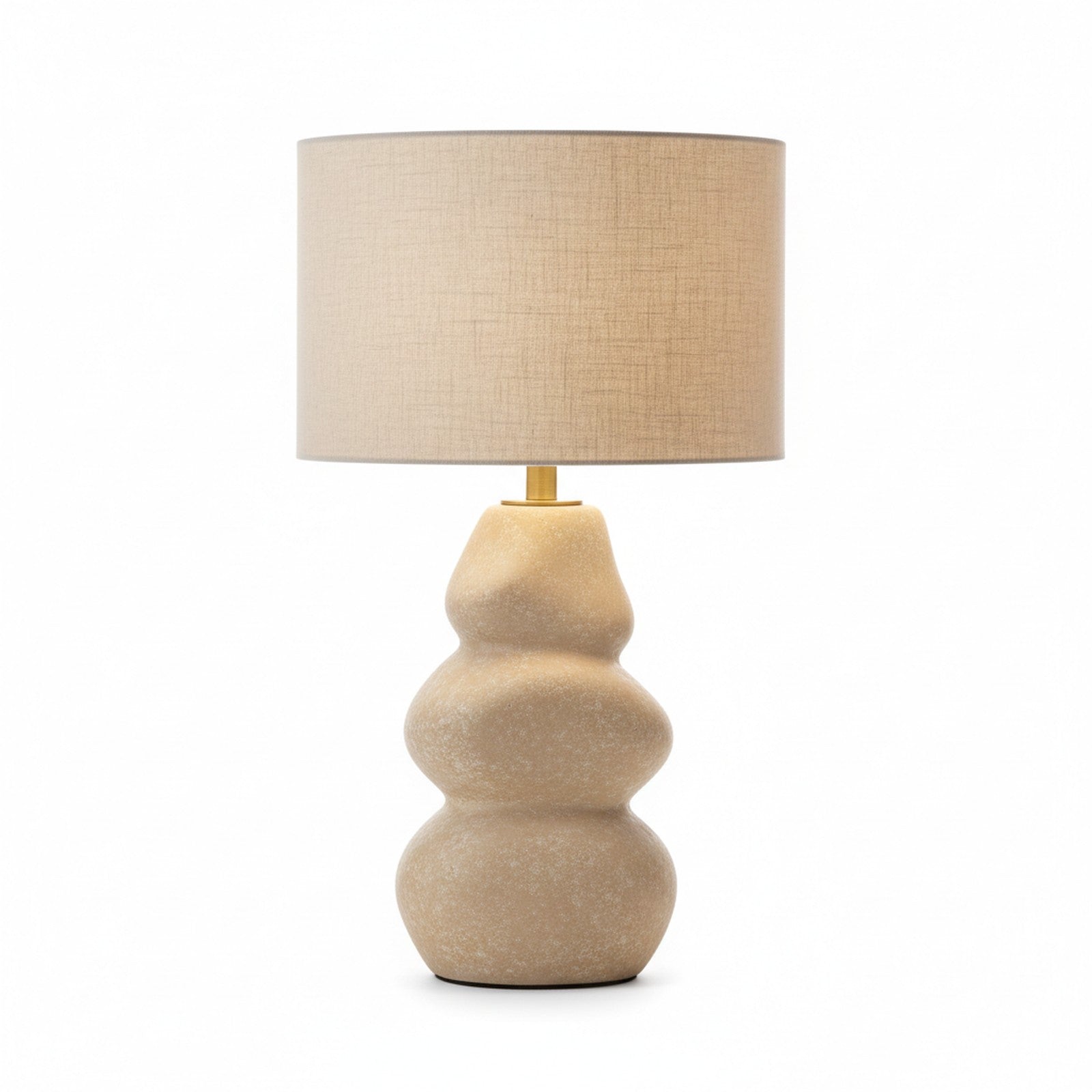 Cast stone sculptural table lamp in natural beige with organic river stone form and linen shade