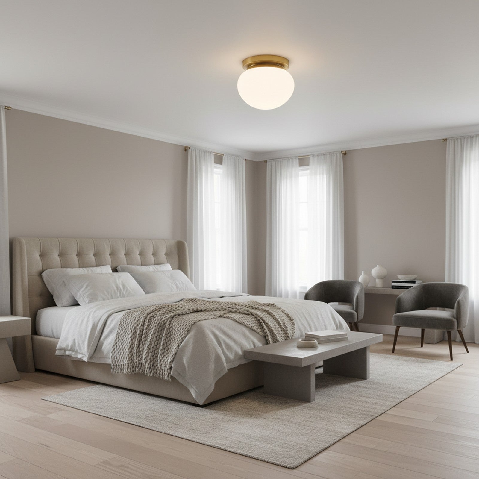 Flush mount ceiling light providing soft ambient illumination in modern neutral bedroom