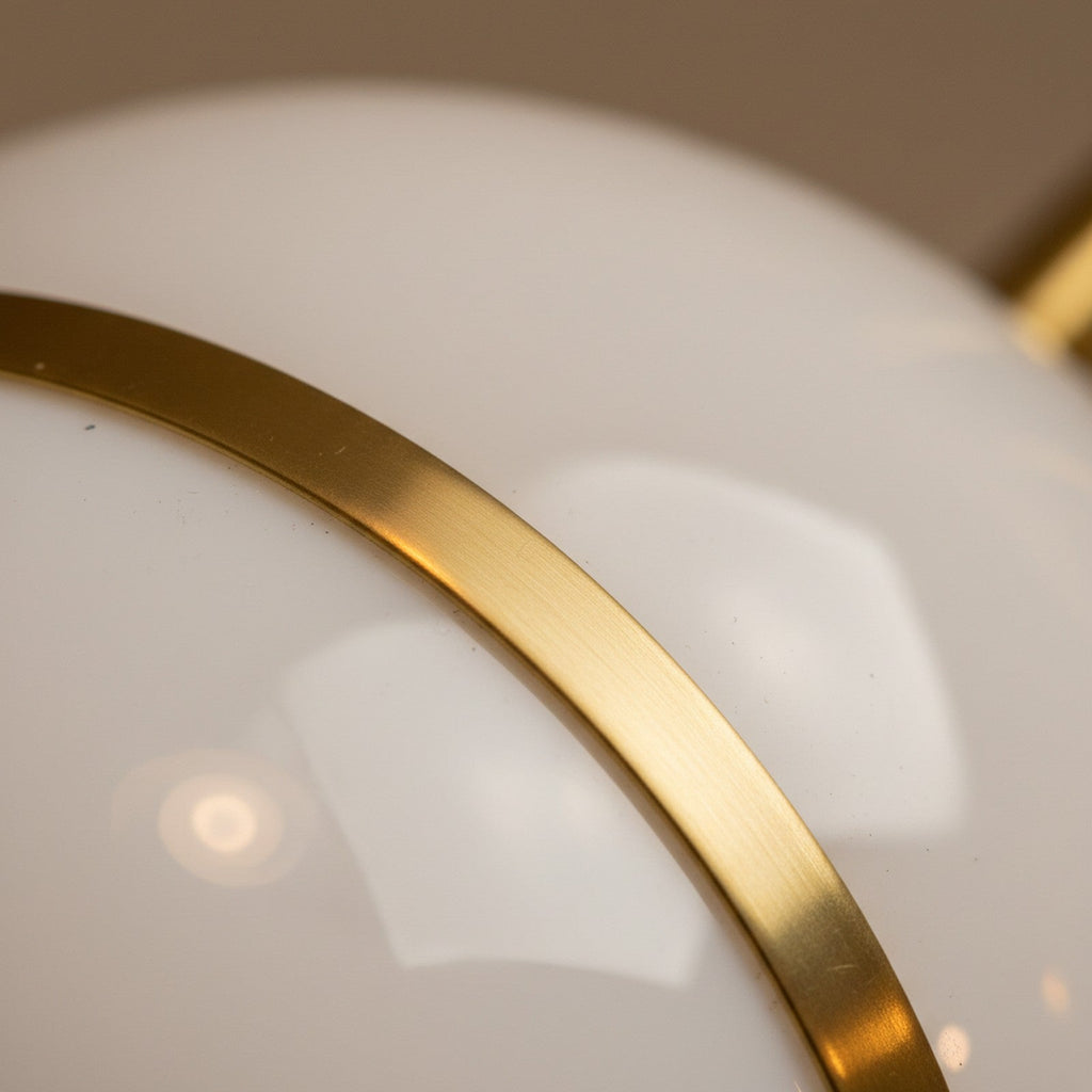 Close-up of opal glass dome and brass rim junction showing translucent glass quality